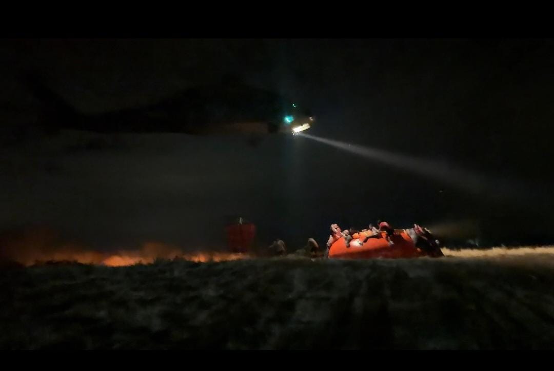 Using night-vision goggles, the Army Aviation supports firefighting efforts in Tolima